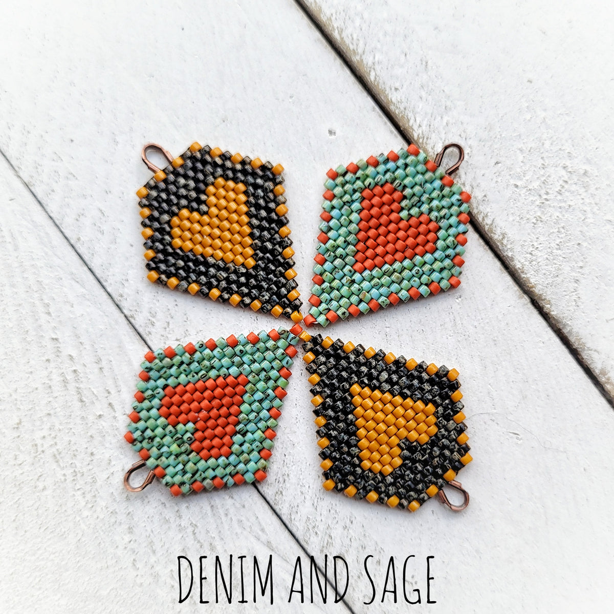 Black picasso and hawthorne heart beaded earrings